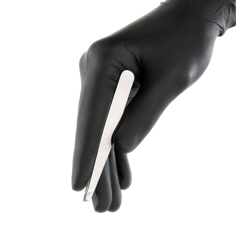 PhiBrows Stainless Steel Scissors & Tweezers — eyebrow tweezers held in a gloved hand