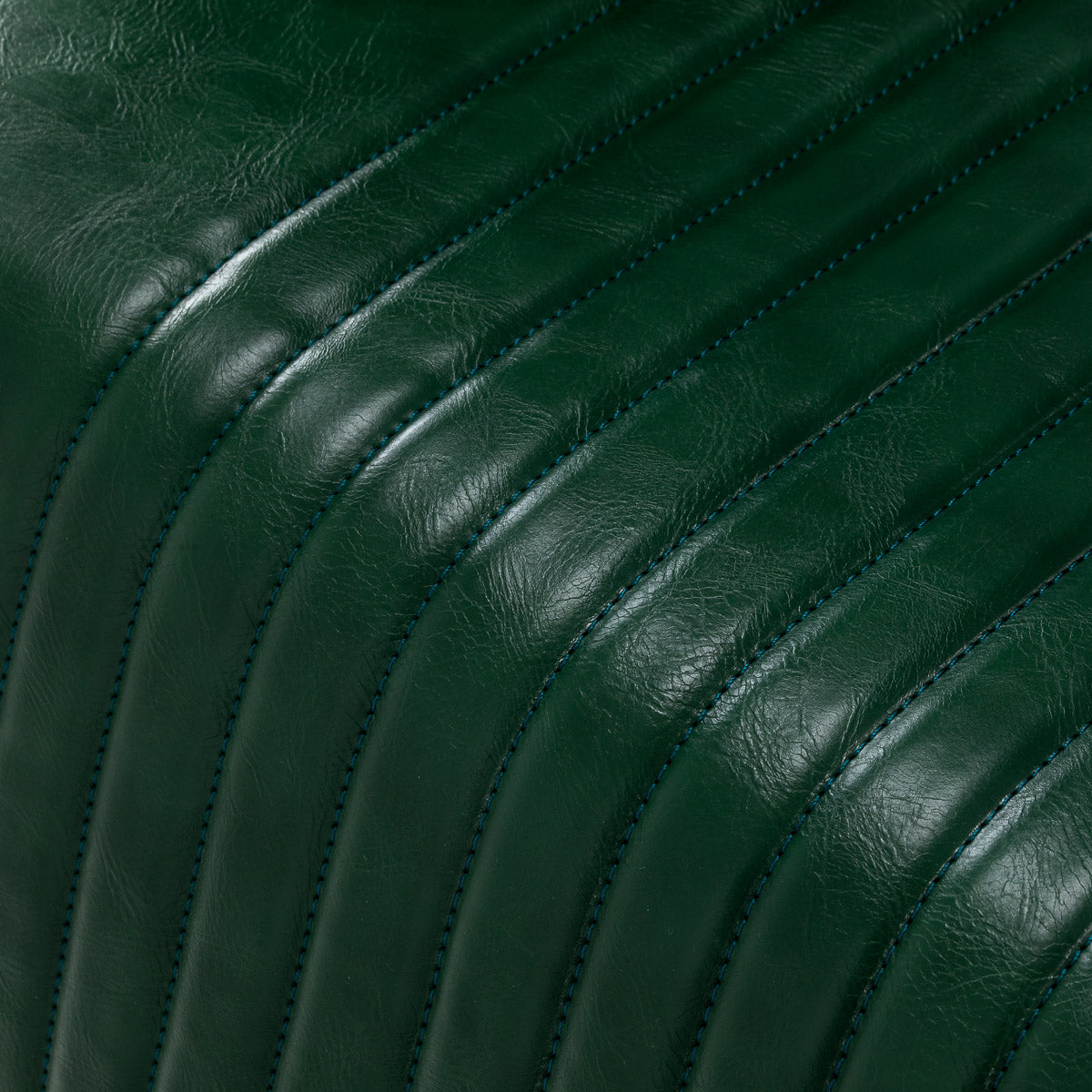 Green Gabbiano Royal X barber chair with padded backrest and armrests, featuring adjustable headrest for barbershop use.