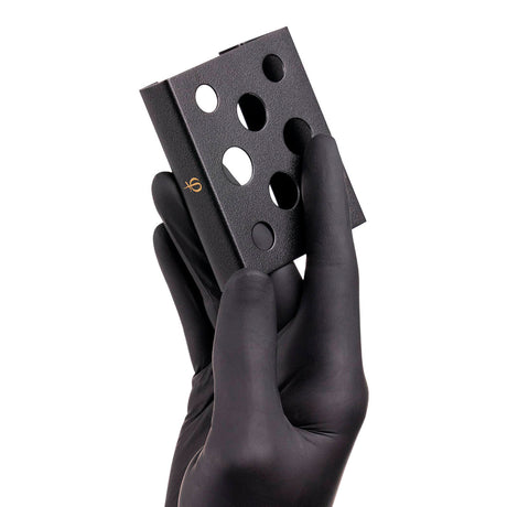PhiAcademy Ink Cup Holder — metal pigment cup holder held in a gloved hand