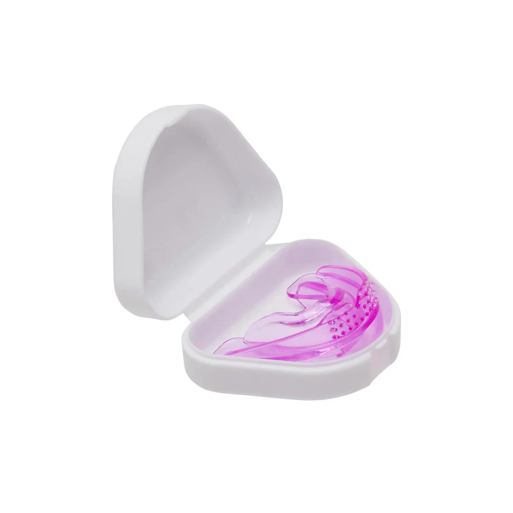 Close-up of the BVShop Ultimate Beauty Lip Assist Pink tube with the pink lip balm product and packaging.