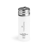 The Perma Mapping String Bottle in black, red, and white with a slim, cylindrical design and colorful string wrapping around the exterior.