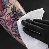 Unistar Nebula Tattoo Spray 240ml bottle with label, designed for tattoo aftercare and skin hydration.